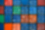 Four vertical rows of shipping containers