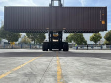 Forklift moving storage container