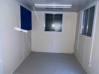 Internal view of cabin showing windows covered by blinds 